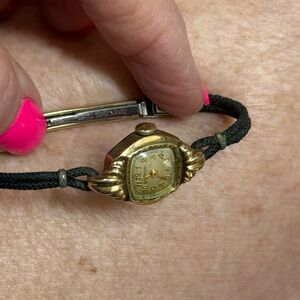 Vintage Bulova Watch. Stainless Back. Black leather band. 10k . needs battery.